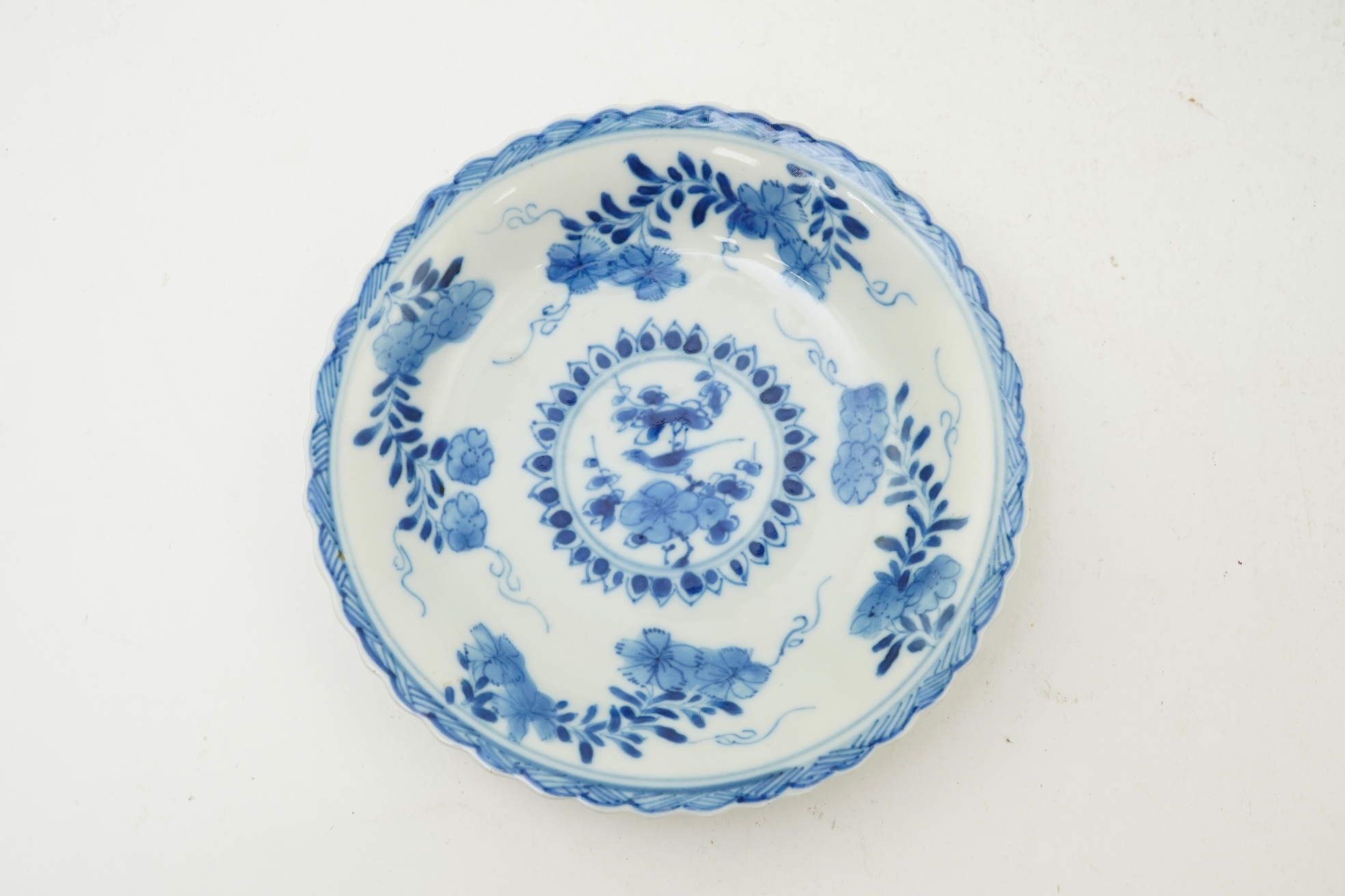 A Chinese blue and white tea bowl and saucer, Kangxi period